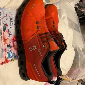 On Running Men’s Athletic Shoes in Bright Orange with Black Soles